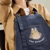 SERIA MONȘTRII CĂDEAU ÎN SĂLBĂTICIE – Geantă șorț din denim